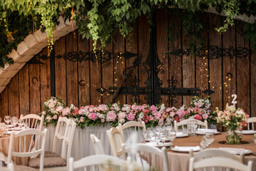 Main table at a wedding reception with beautiful flowers