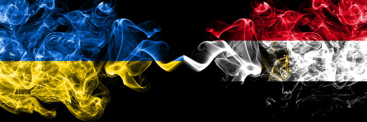 Ukraine, Ukrainian vs Egypt, Egyptian smoky mystic flags placed side by side. Thick colored silky abstract smokes flags.
