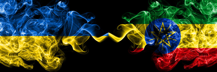 Ukraine, Ukrainian vs Ethiopia, Ethiopian smoky mystic flags placed side by side. Thick colored silky abstract smokes flags.