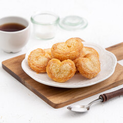 Delicious Palmier butterfly pastry in heart shape for Mother's day dessert.