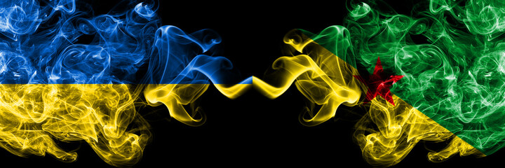 Ukraine, Ukrainian vs France, French Guiana smoky mystic flags placed side by side. Thick colored silky abstract smokes flags.