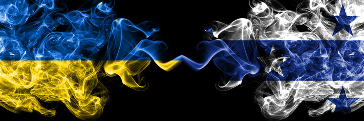 Ukraine, Ukrainian vs Gambier Islands smoky mystic flags placed side by side. Thick colored silky abstract smokes flags.
