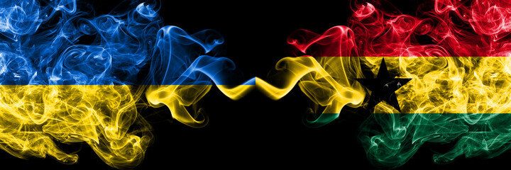 Ukraine, Ukrainian vs Ghana, Ghanaian smoky mystic flags placed side by side. Thick colored silky abstract smokes flags.