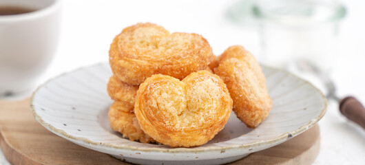 Delicious Palmier butterfly pastry in heart shape for Mother's day dessert.
