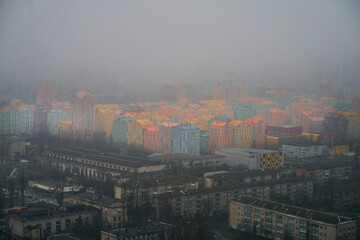 Aerial view of infrastucture in the colorful modern city. Comfort town Kyiv Ukraine. Foggy dull day in the capital city