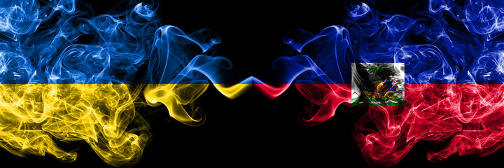 Ukraine, Ukrainian vs Haiti smoky mystic flags placed side by side. Thick colored silky abstract smokes flags.
