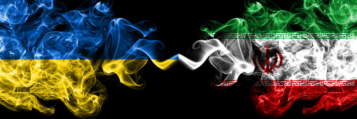 Ukraine, Ukrainian vs Iran, Iranian smoky mystic flags placed side by side. Thick colored silky abstract smokes flags.