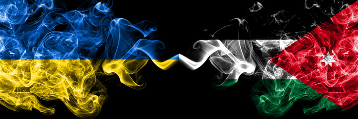 Ukraine, Ukrainian vs Jordan, Jordanian smoky mystic flags placed side by side. Thick colored silky abstract smokes flags.
