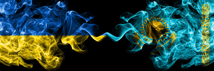 Ukraine, Ukrainian vs Kazakhstan, Kazakhstani smoky mystic flags placed side by side. Thick colored silky abstract smokes flags.