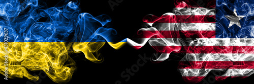 Ukraine, Ukrainian vs Liberia smoky mystic flags placed side by side. Thick colored silky abstract smokes flags.