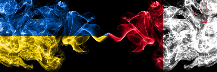 Ukraine, Ukrainian vs Malta, Maltese smoky mystic flags placed side by side. Thick colored silky abstract smokes flags.