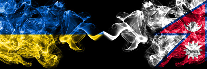Ukraine, Ukrainian vs Nepal, Nepali, Nepalese smoky mystic flags placed side by side. Thick colored silky abstract smokes flags.