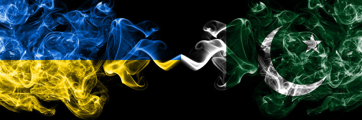 Ukraine, Ukrainian vs Pakistan, Pakistani smoky mystic flags placed side by side. Thick colored silky abstract smokes flags.