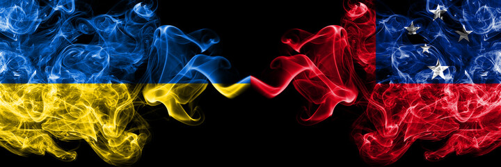 Ukraine, Ukrainian vs Samoa smoky mystic flags placed side by side. Thick colored silky abstract smokes flags.