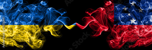 Ukraine, Ukrainian vs Samoa smoky mystic flags placed side by side. Thick colored silky abstract smokes flags.