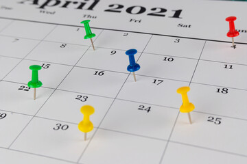 Thumbtack in calendar concept for busy