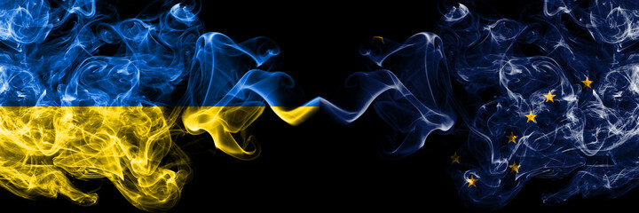 Ukraine, Ukrainian vs United States of America, America, US, USA, American, Alaska, Alaskan smoky mystic flags placed side by side. Thick colored silky abstract smokes flags.