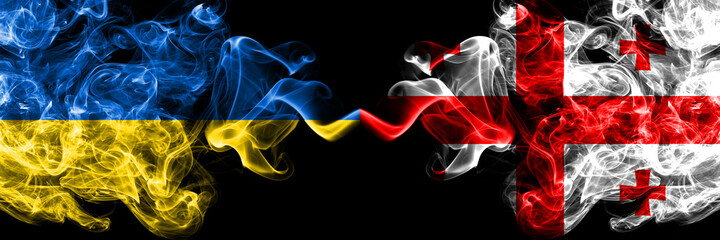 Ukraine, Ukrainian vs United States of America, America, US, USA, American, Georgia smoky mystic flags placed side by side. Thick colored silky abstract smokes flags.