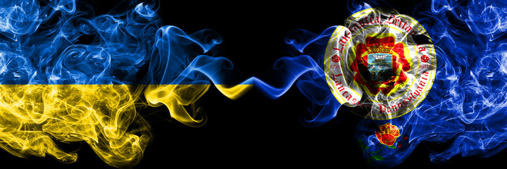 Ukraine, Ukrainian vs United States of America, America, US, USA, American, Lancaster, Pennsylvania smoky mystic flags placed side by side. Thick colored silky abstract smokes flags.