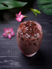 Rose milk tea with bubble (tapioca ball)on wood background