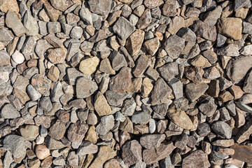 Beautiful texture of orange stones is on the beach by sea