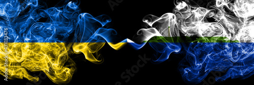 Ukraine, Ukrainian vs United States of America, America, US, USA, American, Navassa Island smoky mystic flags placed side by side. Thick colored silky abstract smokes flags.