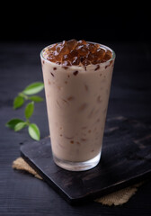 Taiwan milk tea with bubble (tapioca ball)on wood background