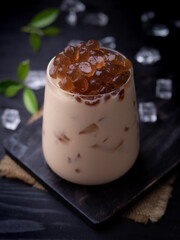 Taiwan milk tea with bubble (tapioca ball)on wood background