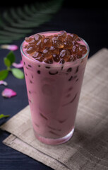 Rose milk tea with bubble (tapioca ball)on wood background