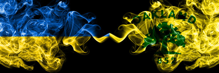 Ukraine, Ukrainian vs United States of America, America, US, USA, American, Oakland, California smoky mystic flags placed side by side. Thick colored silky abstract smokes flags.