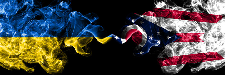 Ukraine, Ukrainian vs United States of America, America, US, USA, American, Ohio smoky mystic flags placed side by side. Thick colored silky abstract smokes flags.