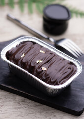 Chocolate soft cake in the aluminium foil box