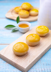Chinese pastry puff, Beans cake with salted egg yolk lay on table wood,Homemade bakery concept.