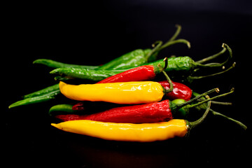 colorful chili pepper on a black background