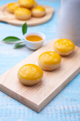 Chinese pastry puff, Beans cake with salted egg yolk lay on table wood,Homemade bakery concept.