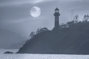 Beautiful seascape with lighthouse on sunrise