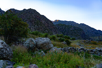 view of rocks and mountains and grass