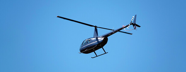 Helicopter in the blue sky