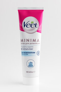 Veet depilation cream for sensitive skin. Less chemical components. A tube of cream on a light table