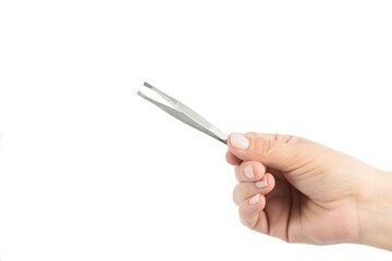 female hand holding tweezers for plucking, on white background space for text