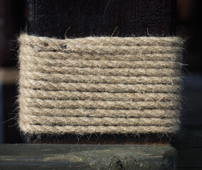 rope wrapped around a wooden pole