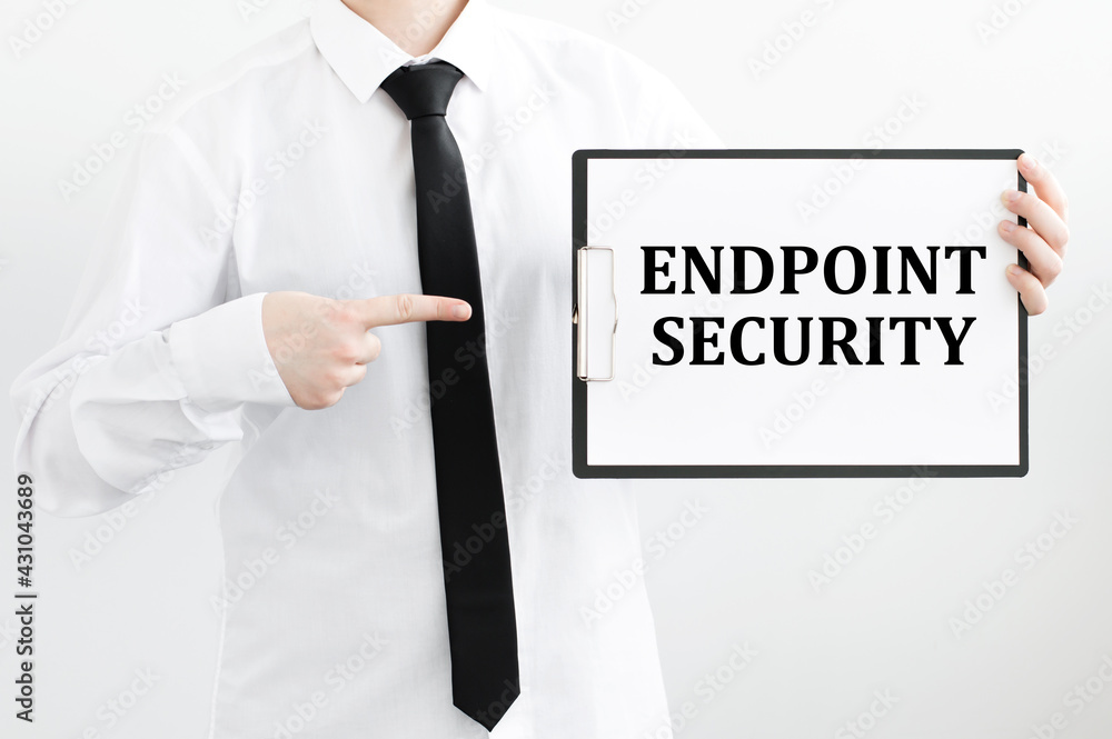 Poster endpoint security text on white paper in the hands of a man on a light background
