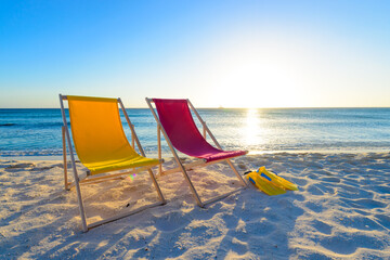 Colorful beach lounge chairs at the beach