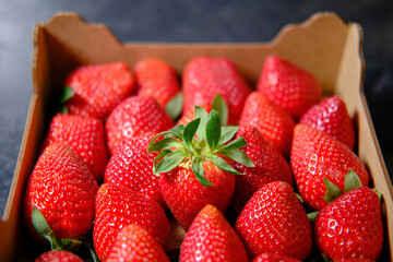Fresh strawberries in a wooden strawberry basket