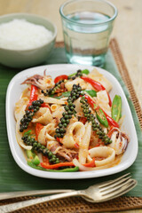 stir fried fresh squid with kampot pepper, cambodian cuisine
