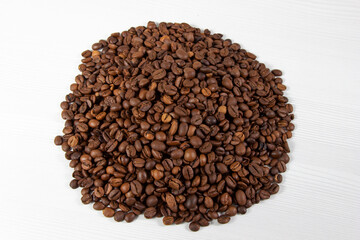 A pile of coffee beans on a white background