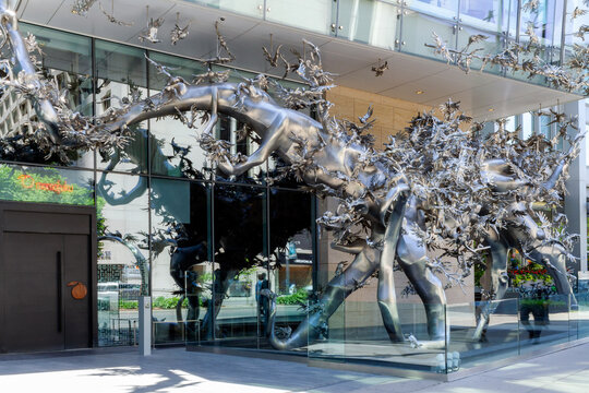 Toronto, Canada - June 12, 2018: A major metal work of public art in Toronto, simply astounding, called "Rising", by Shanghai-based artist Zhang Huan, in front of Momofuku Noodle Bar restaurant.