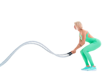 Woman doing exercises with battle rope.