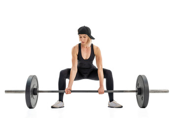 Fototapeta na wymiar Young woman doing deadlift with a barbell isolated on white
