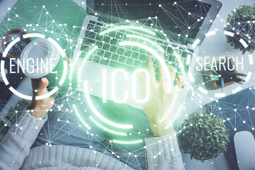 Double exposure of woman hands working on computer and blockchain theme hologram drawing. Top View....